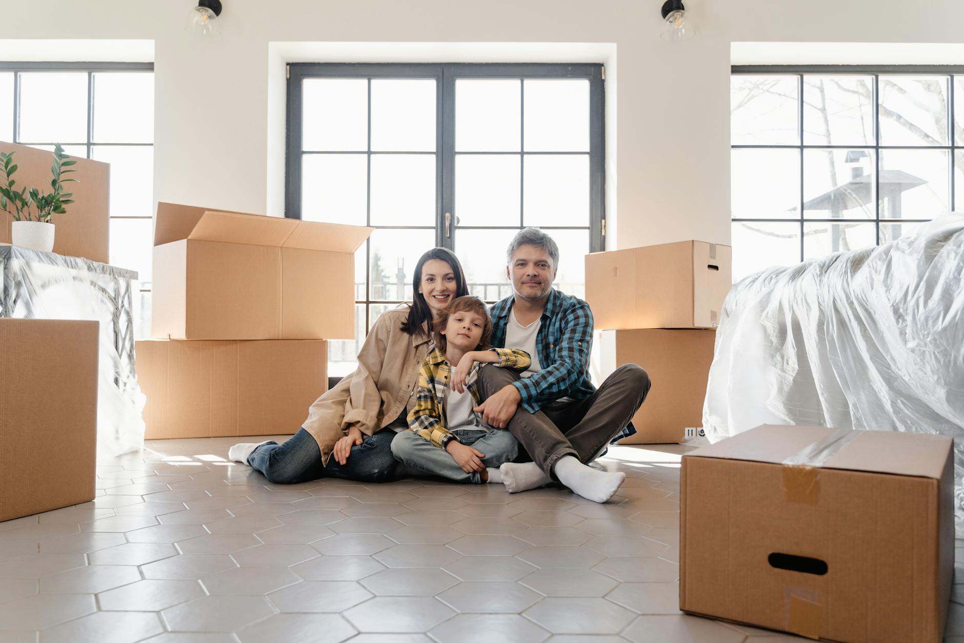 Satisfied family moving into new comfortable apartment