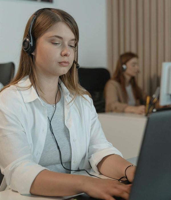 woman with headset providing customer support