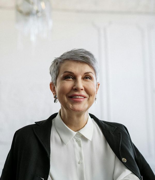 woman with warm smile in professional office setting